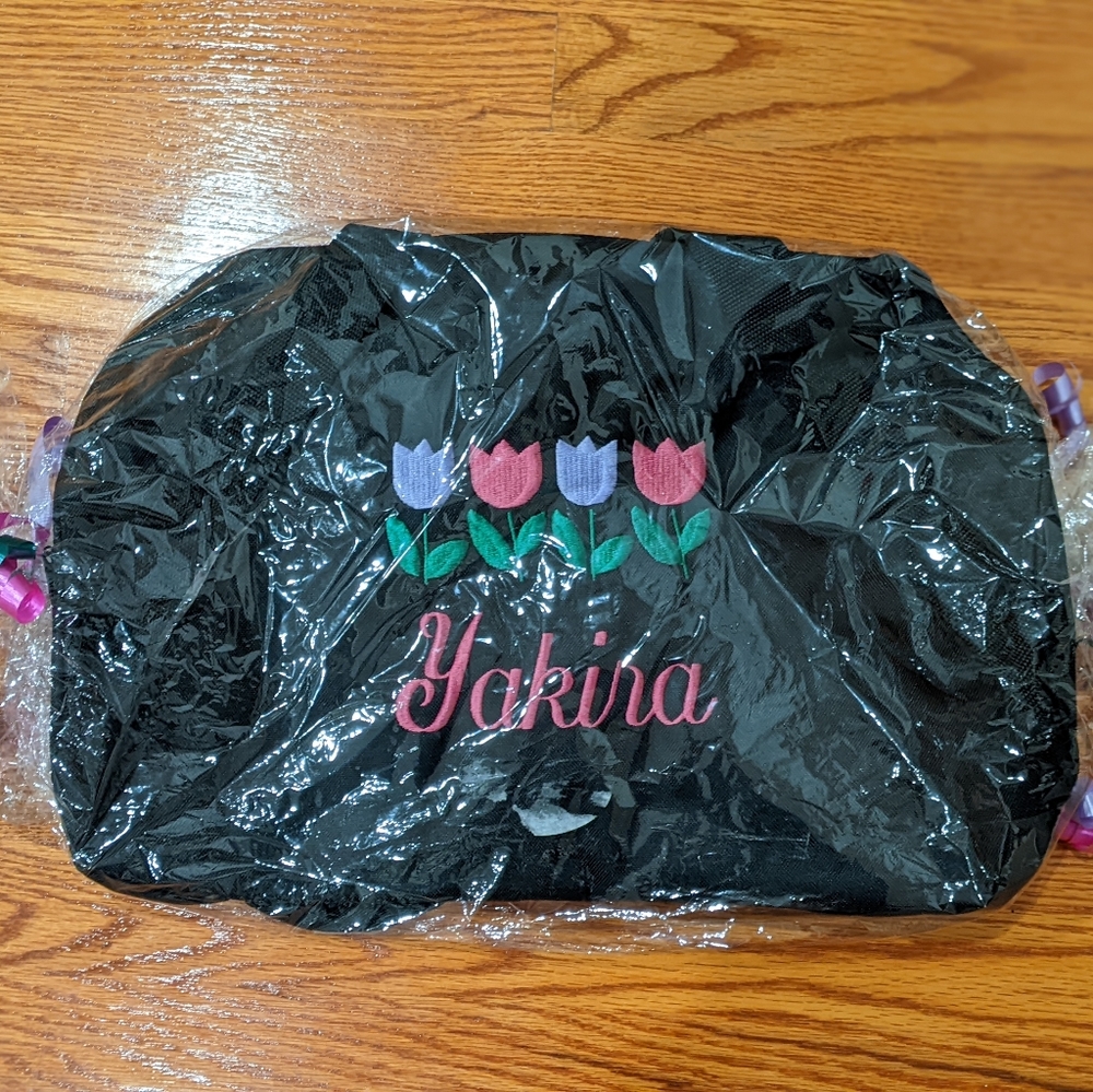 Embroidered kids travel bag in gift packaging.